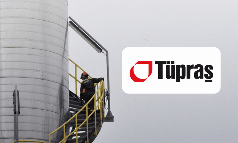 a refinery worker climbing on a high ladder on a very cloudy day, tupras logo