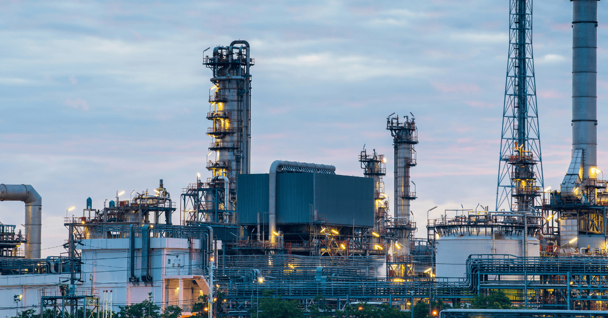 oil and gas refinery in front of a river