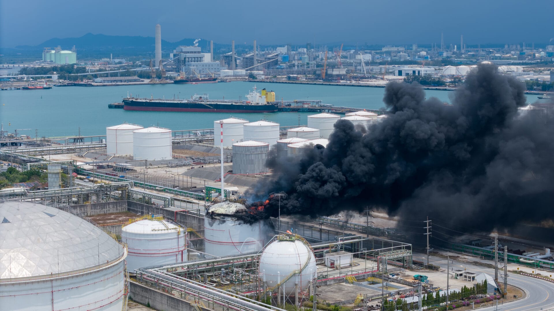 huge fire exploding at a chemical storage tank in oil refinery plant. as the blaze was likely to spread. storage tank of pyrolysis gas exploding.